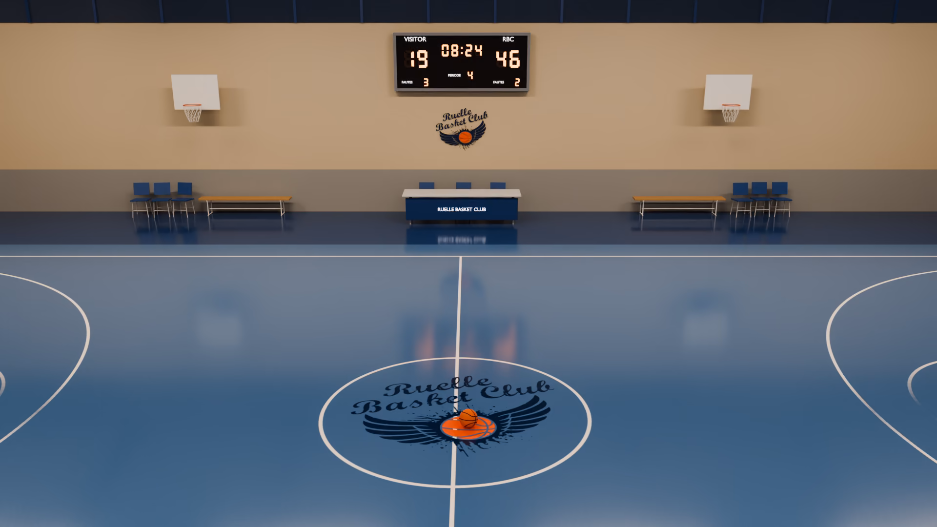 Le terrain du Ruelle Basket Club au gymnase de Puyguillen : le rond central porte le blason du club, le tableau d'affichage et le logo peint sont au fond de la salle.